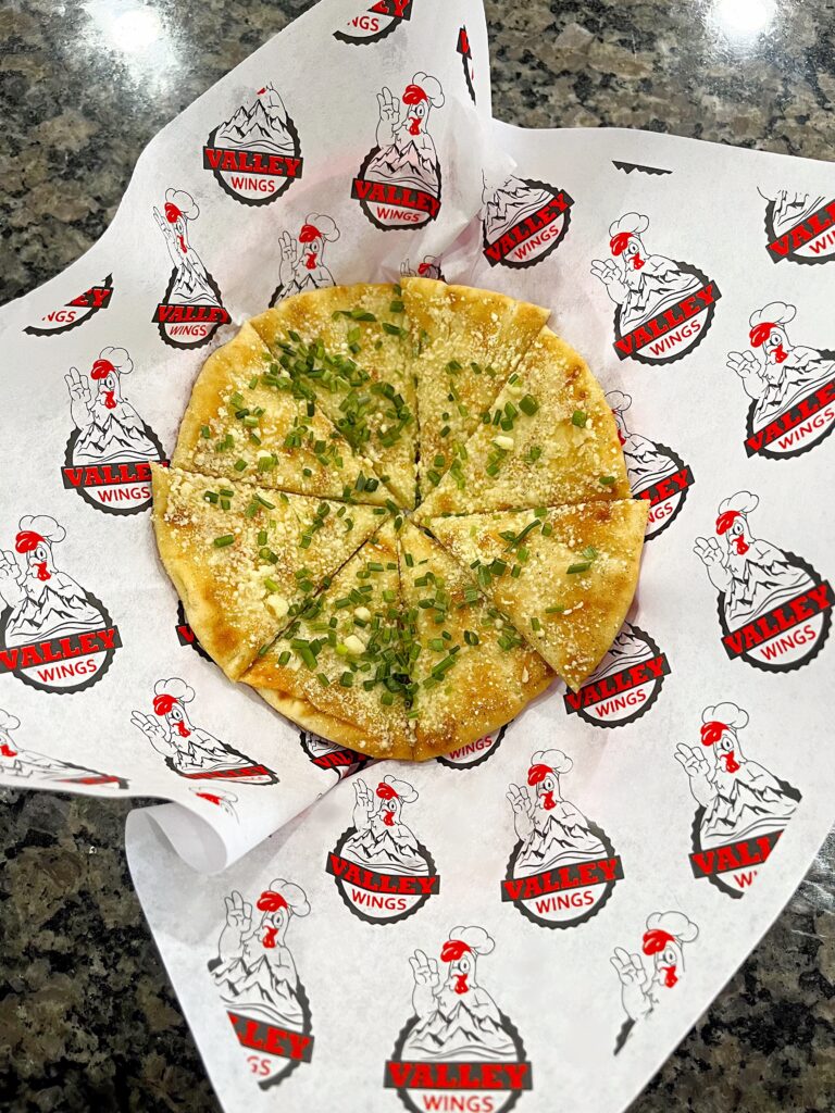 Toasted garlic pita bread with garlic butter and chives